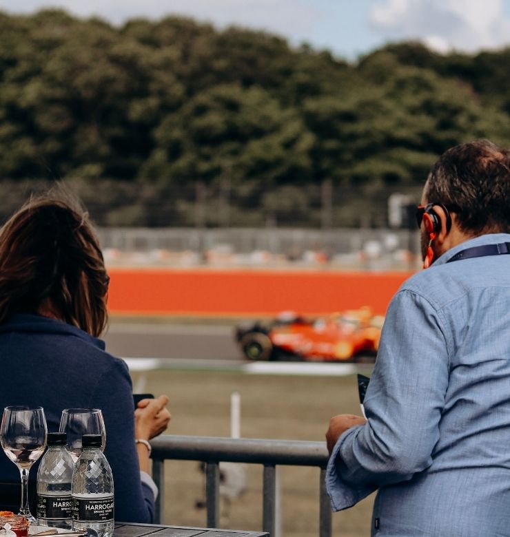 Spectator watching a formula 1 car