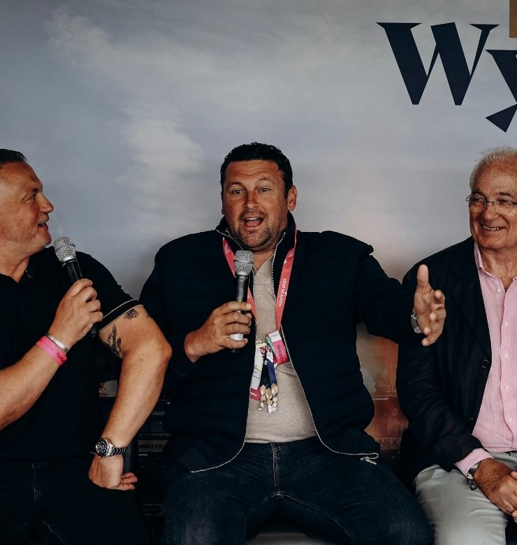 3 men speaking with microphones