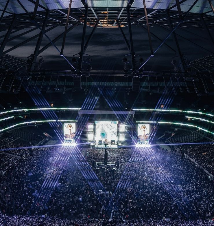 inside of concert with crowd ad stage