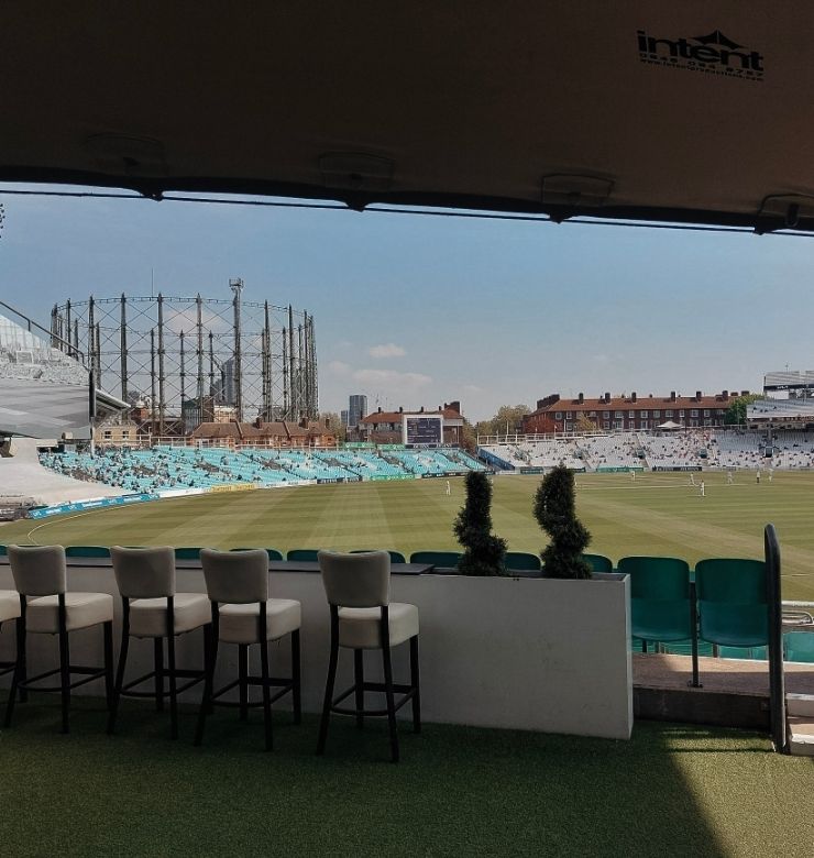 bar seats looking over cricket field