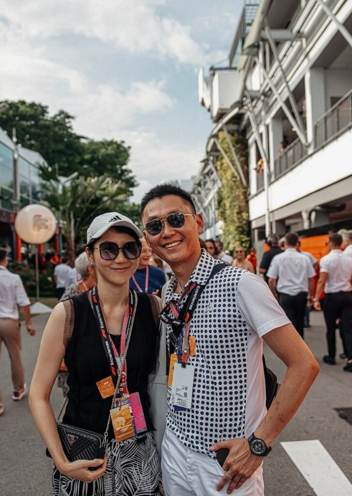 2 people standing at the Grand Prix