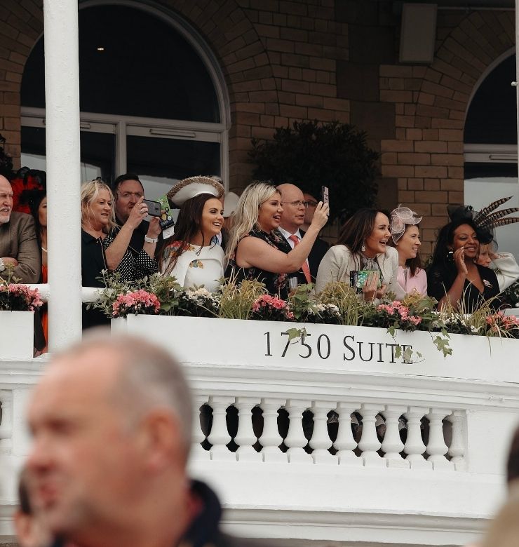 People on balcony in hospitality area